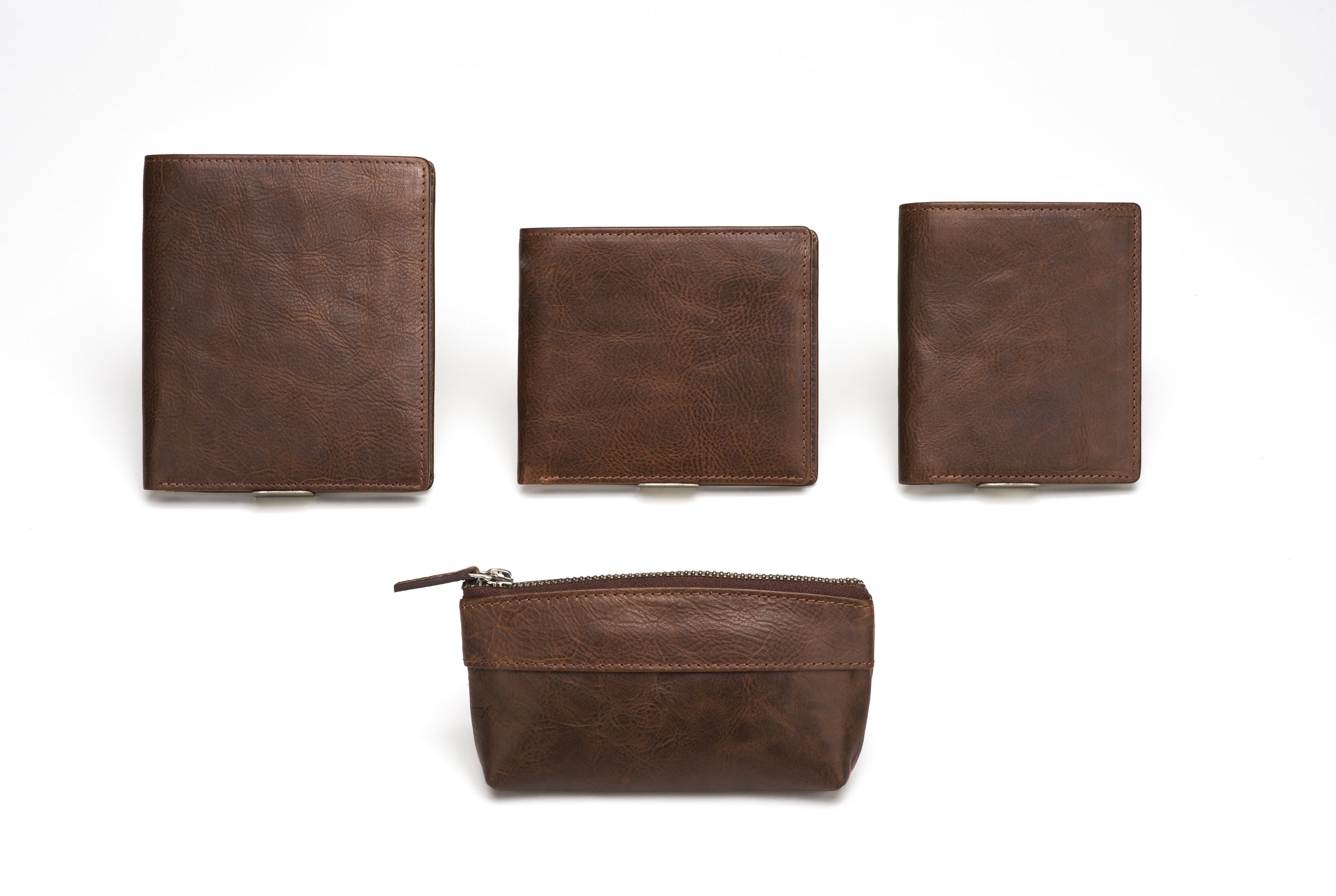 Assortment of leather wallets and coin pouches in rich cognac shade